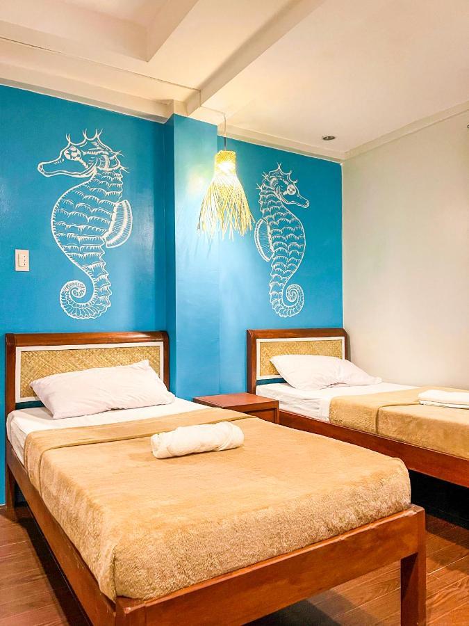 Amos Portside Inn Эль-Нидо Экстерьер фото